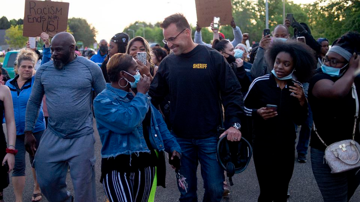 Flint Michigan Police march with protestors